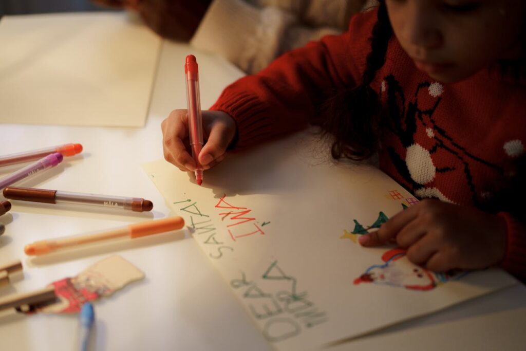 girl making chrismtas card - christmas activities