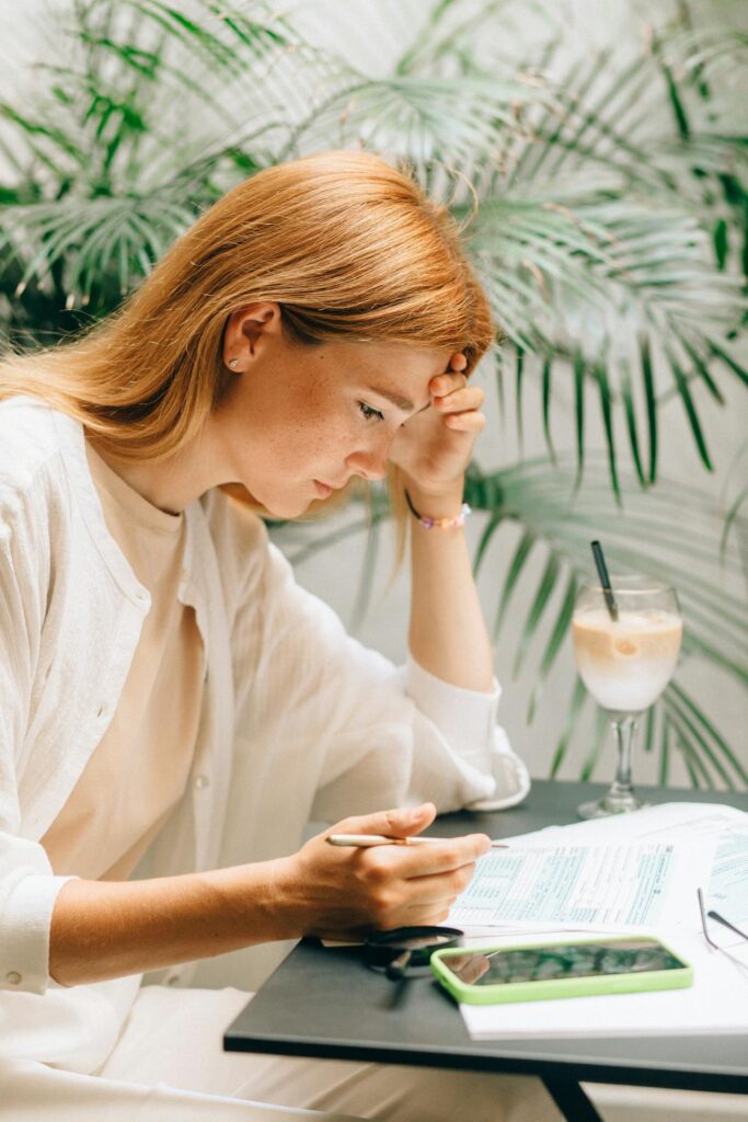 woman looking at bills