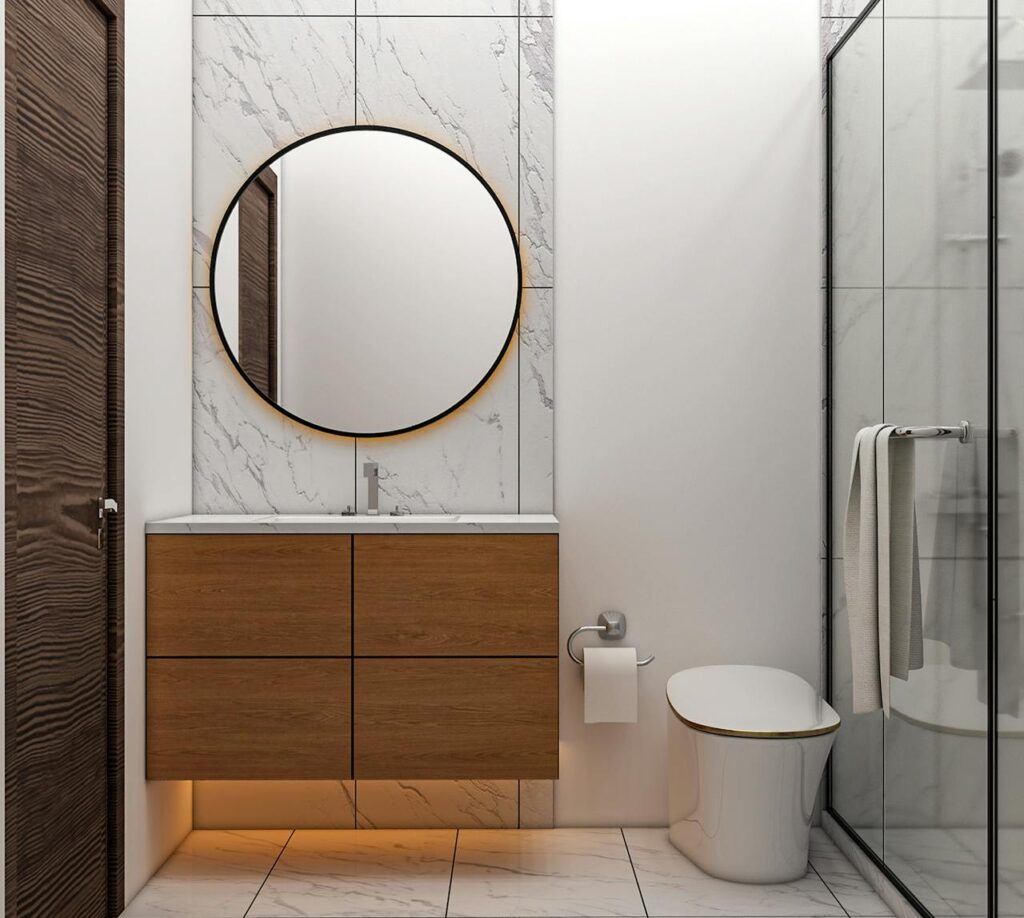 Contemporary bathroom featuring wooden vanity, round mirror, and glass shower.